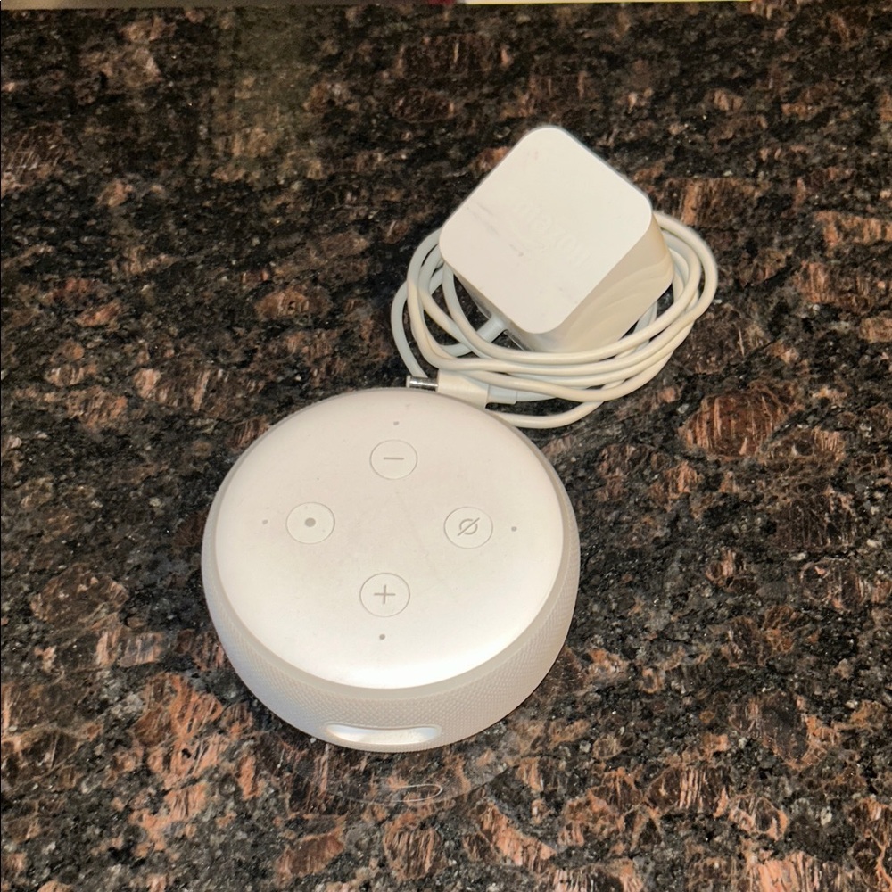 White Amazon Echo Dot with power cord